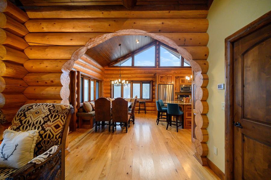 Log archway into the great room and dining area